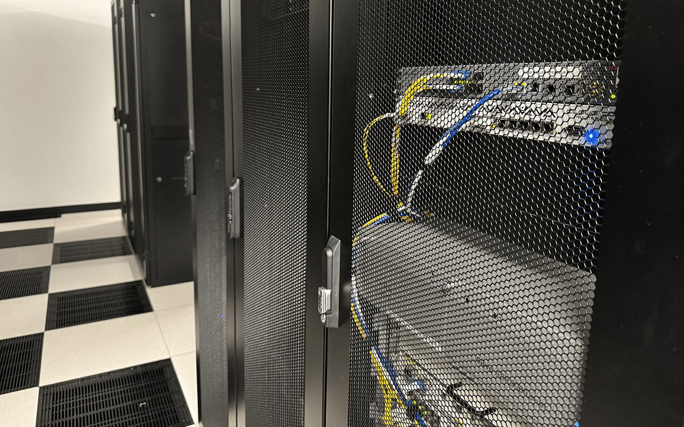 A cold-aisle of racks in a FyfeWeb UK data centre