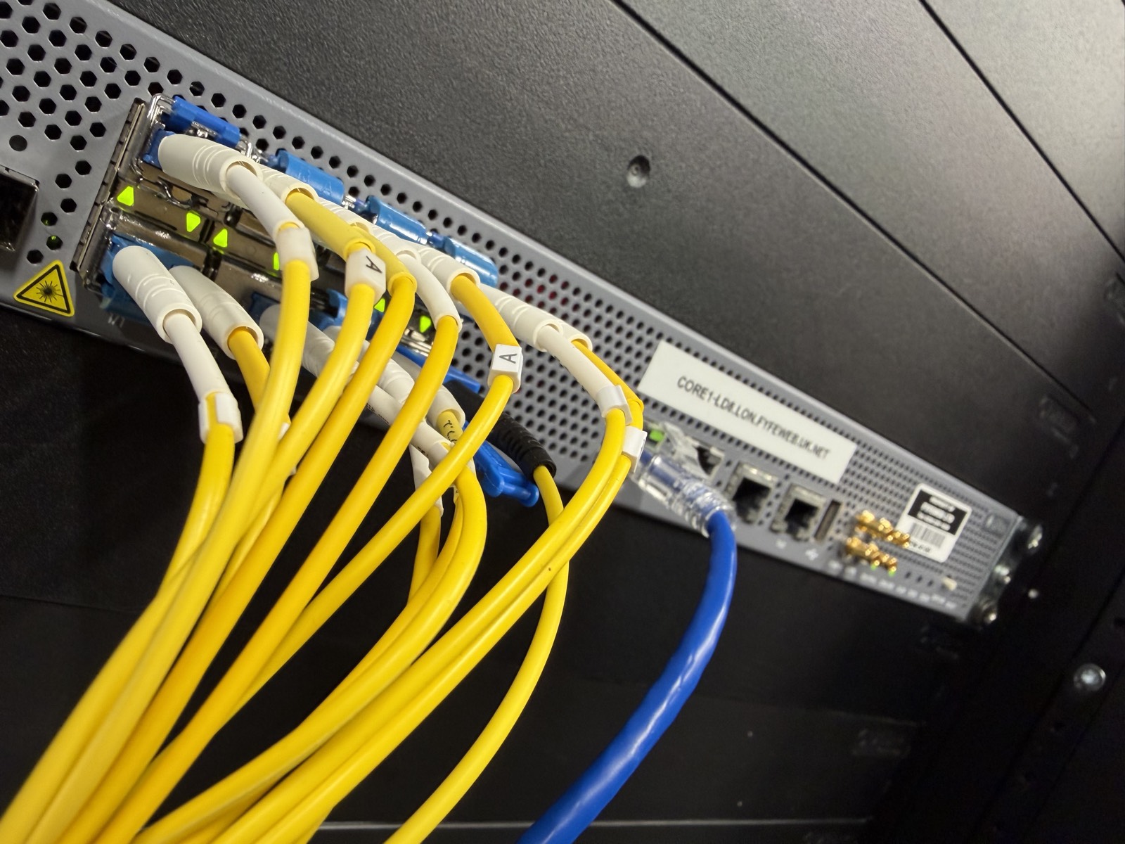 Single-mode fibre patched into a FyfeWeb core router labelled CORE1-LD8.LON.FYFEWEB.UK.NET